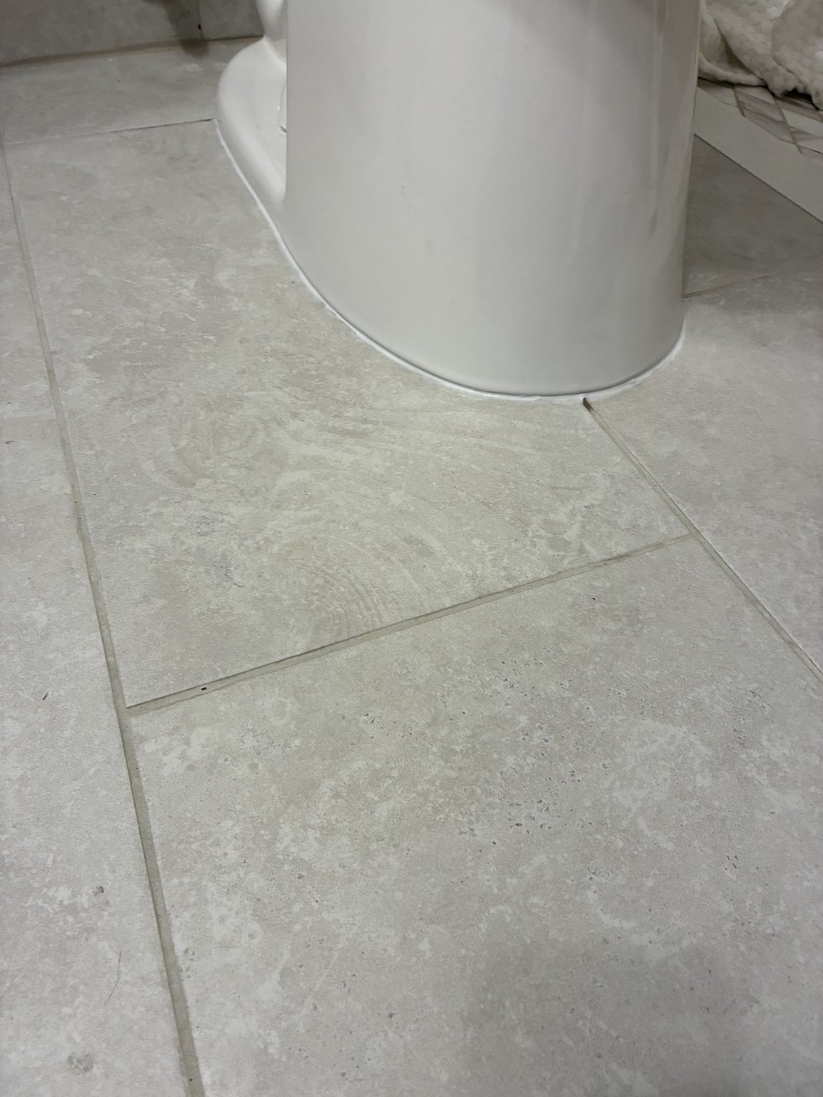 Final bathroom tile and toilet finishing detail
